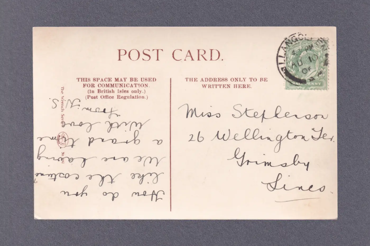 The back of a postcard dating from 1910 showing copperplate handwriting, with a green halfpenny stamp.